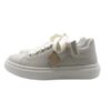 Sneaker in pelle con lacci in raso
