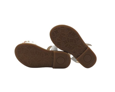 Sandalo in pelle con pom pon e fibia