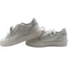 Sneaker in pelle con lacci, zip e applicazione fiocco strass