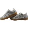Sneaker in camoscio e glitter con lacci e zip