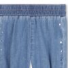 Pantalone in denim leggero con borchie laterali