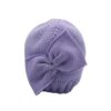 Cappello con fiocco e pon pon laterale