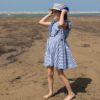 Vestito a righe con rouches e fiocchetti laterali