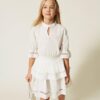 Vestito in cotone con pizzo e balze