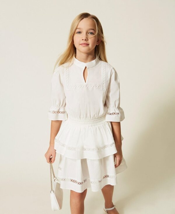 Vestito in cotone con pizzo e balze