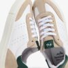 Sneaker in pelle e camoscio con lacci e zip