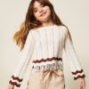 Maglia girocollo a zig-zag con frange
