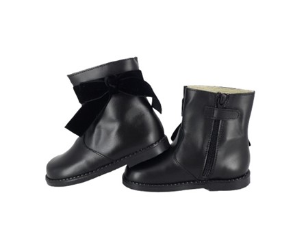 Stivaletto in pelle con fiocchetto in velluto e zip