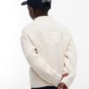 Maglione con trecce e logo sul retro
